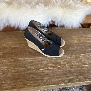 Tom’s black wedge shoes